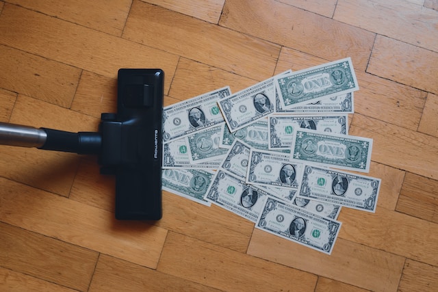 vacuuming dollar bills